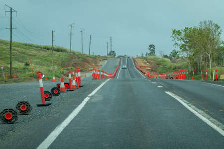 Bruce Highway Mackay to Townsville, Queensland, Australia - November 2021: Cars traveling on highway amongst road worksのeditorial素材