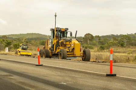 Bruce Highway Mackay to Townsville, Queensland, Australia - November 2021: Heavy machinery working on highway duplication construction projectのeditorial素材