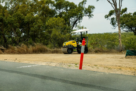 Bruce Highway Mackay to Townsville, Queensland, Australia - November 2021: Road building machine...