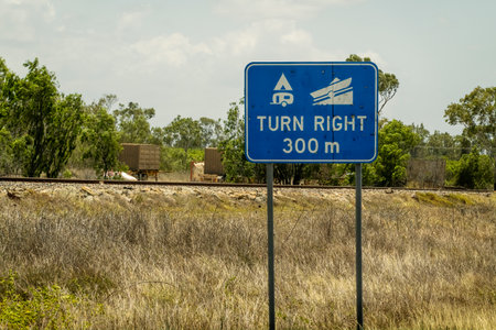 Sign denoting a caravan and camping area and boat ramp on the right in 300 meters - roadside highway signageの写真素材