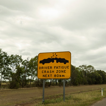 Driver fatigue crash zone warning road sign with car smash iconsの写真素材
