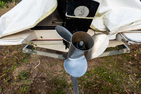 Close up of the propeller of a speed boat on a trailer in a backyardの写真素材