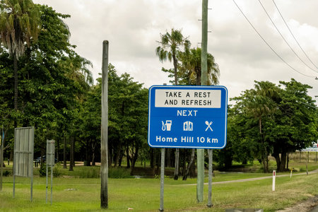 Townsville to Mackay highway, Queensland, Australia - November 2021: Roadside sign advising...