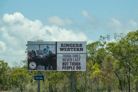 Bruce Highway Townsville to Mackay, Queensland, Australia - November 2021: Outdoor advertising billboard for western gearのeditorial素材