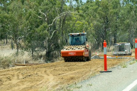 Bruce Highway Townsville to Mackay, Queensland, Australia - November 2021: Heavy machine working on...