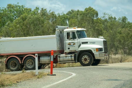 Bruce Highway Townsville to Mackay, Queensland, Australia - November 2021: Large cargo truck turning onto country highwayのeditorial素材