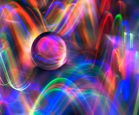 Softly swirling colorful light circling a lens ball