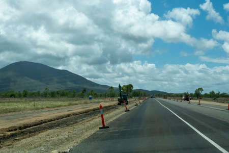 Bruce Highway Townsville to Mackay, Queensland, Australia - November 2021: Machines working on road construction for duplication of highwayのeditorial素材