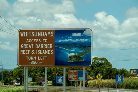 Proserpine, Queensland, Australia - November 2021: Outdoor billboard advertising directions to Whitsundaysのeditorial素材