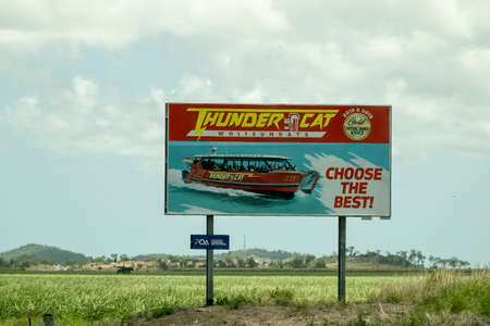 Bruce Highway Townsville to Mackay, Queensland, Australia - November 2021: Thunder Cat Whitsundays Outdoor Advertising Billboardのeditorial素材