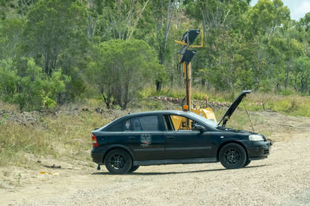Bruce Highway Townsville to Mackay, Queensland, Australia - November 2021: Car broken down on side of road under roadworks lightsのeditorial素材