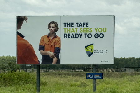 Bruce Highway, Townsville to Mackay, Queensland, Australia - November 2021: Tafe University outdoor advertising billboardのeditorial素材