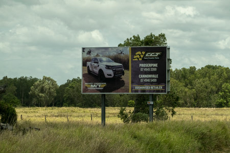 Bruce Highway, Townsville to Mackay, Queensland, Australia - November 2021: Motor Dealer outdoor advertising signのeditorial素材
