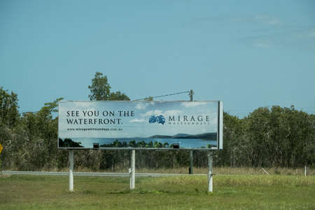 Bruce Highway, Townsville to Mackay, Queensland, Australia - November 2021: Advertising billboard for Mirage Whitsundays accommodation precinctのeditorial素材