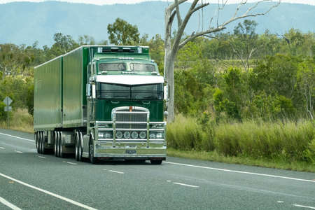 Bruce Highway, Townsville to Mackay, Queensland, Australia - November 2021: A semi trailer truck carting freight between townsのeditorial素材