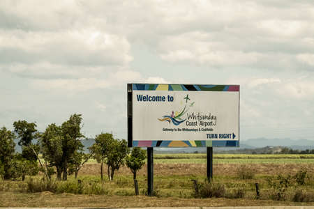 Bruce Highway, Townsville to Mackay, Queensland, Australia - November 2021: Billboard advertising Whitsunday Coast Airportのeditorial素材