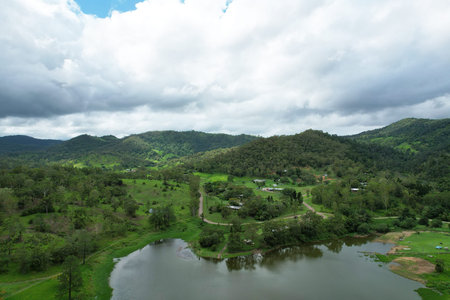 The calm waters under a cloudy sky at Middle Creek Dam, Queensland, Australia