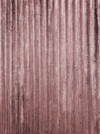 Aged corrugated iron panel that can be used as a background or texture blended into a photograph. Colored coral, pinkの写真素材