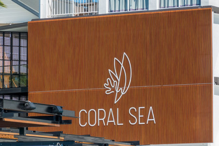 Airlie Beach, Queensland, Australia - January 2022: Coral Sea Resort Hotel sign on exterior of...