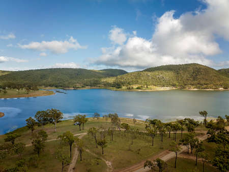 Free camping allowed at Eungella Dam, Queensland, Australia. Campers parked up in their caravan for a holiday.の写真素材