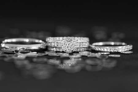 Wedding rings sprinkled with silver love heartsの写真素材