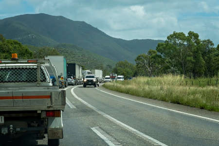 Townsville, Queensland, Australia - May 2022: Line of traffic held up with road works while opposite line goes throughのeditorial素材