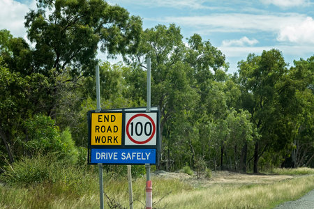 Drive Safety speed limit sign on the side of a country road at the end of road works.