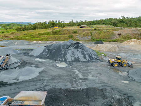 Mackay, Queensland, Australia - May 2022: Infrastructure and the machinery working in a quarry producing industrial rock and stone for construction of roads and other purposes.のeditorial素材