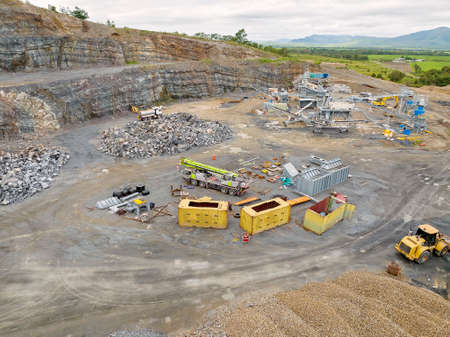 Mackay, Queensland, Australia - May 2022: Infrastructure and the machinery working in a quarry producing industrial rock and stone for construction of roads and other purposes.のeditorial素材