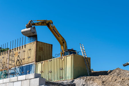 Mackay, Queensland, Australia - 7th June 2022: Crane working in a quarry producing industrial rock...