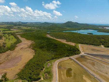 Drone aerial view of a prawn farm currently empty for the winter season. Bush background. Grasstree Beach Queensland Australia.の写真素材
