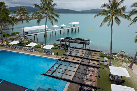 Airlie Beach, Queensland, Australia - April 2023: Looking down onto the pool area of Coral Sea Resortのeditorial素材
