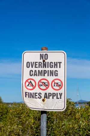 Signage warning of no camping overnight and fines applyの写真素材