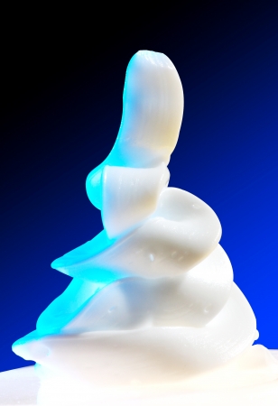 white airy cream hand form with blue screenの写真素材