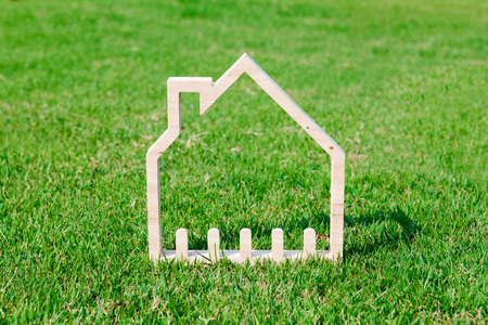 House in green field, house icon conceptの写真素材