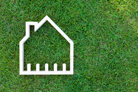 House in green field, house icon conceptの写真素材