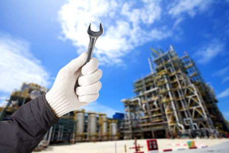 Factory maintenance working with wrench, Repairing heavy industry machine in plantの写真素材