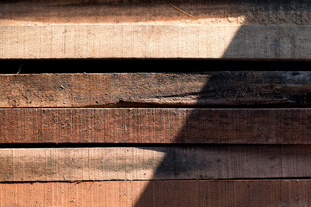 Stack of building Lumber at construction, Wood texture backgroundの写真素材