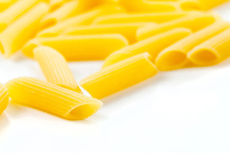 Dried italian pasta macaroni on white backgroundの写真素材