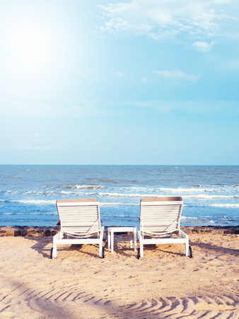 Beach chairs on the sand beach with cloudy blue sky, Relax, vocation timeの写真素材