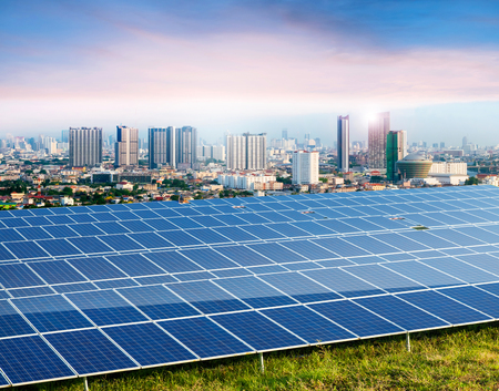 Solar panels, city on background, Ecological energy renewable  solar panel plantの写真素材