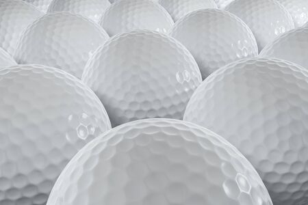 A closeup shot of many golfballs.の写真素材