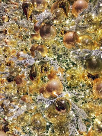 Silver and gold Christmas ornaments and lights background textureの写真素材