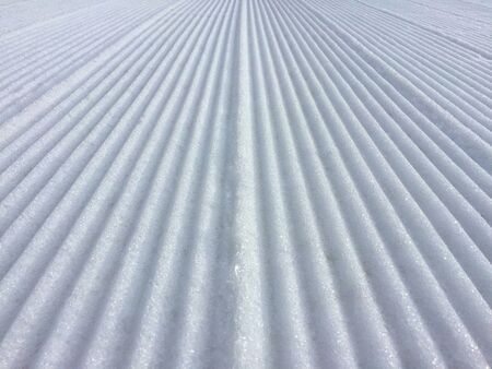 Snow Grooves channels of snow ready for the skiersの写真素材