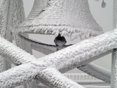 bell on the mountaintop in the winterの写真素材