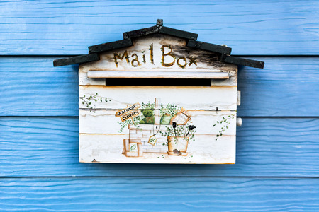 Old mail box on the wooden wallの写真素材