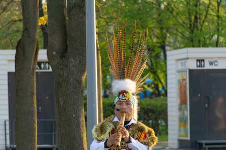 Moscow, Russia, April 30, 2019: A group of Native American Indians in national costumes dancing and...