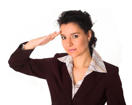 a beautiful mid 20's brunette is saluting her boss or captain. Subordinance. Obedience.の写真素材