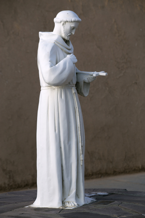 Statue of San Francisco De Asis in fornt of the Taos, New Mexico in front of his namesake church.の写真素材