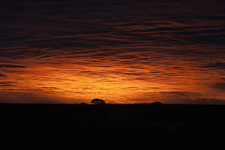 Beautiful orange sunrise in January at the Grand Canyon, AZ.  This is the first light moments before the sun rises above the horizon.の写真素材